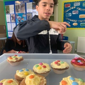 CIN Cake Decorating Male Student With Spotty Cakes