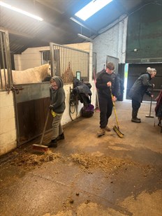 Students Mucking Out Stable