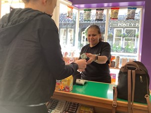 Student Paying In A Shop